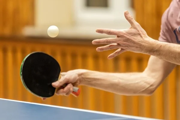 table tennis player serving